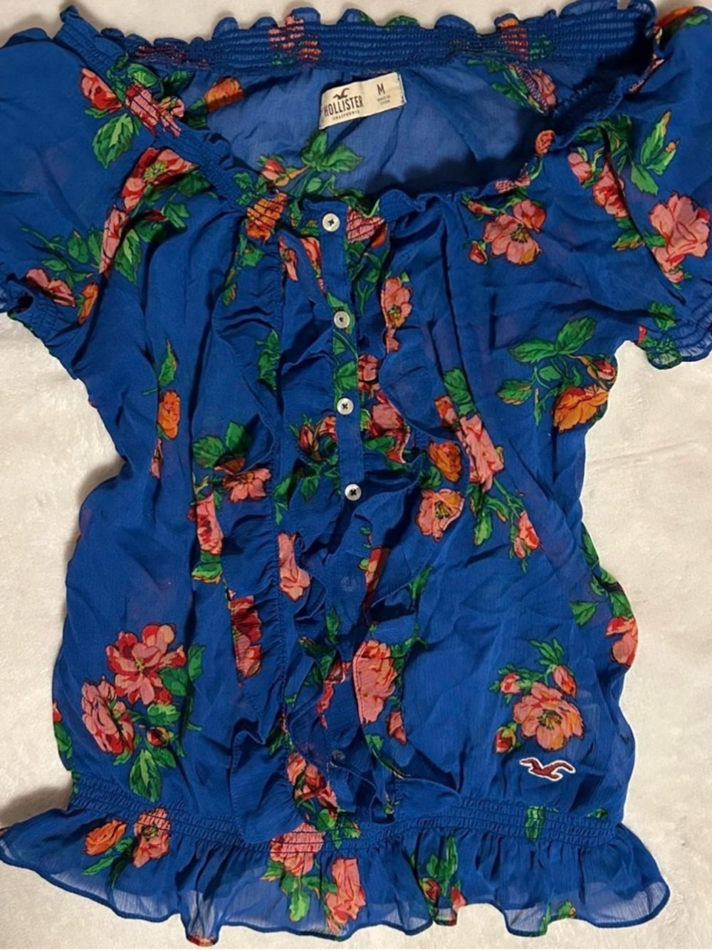 Hollister Blue Floral Off-Shoulder Blouse with ruffles and cinched hem